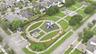 Expansive outdoor grounds featuring manicured lawns, paved pathways, a covered playground structure, multiple pergolas, and structured hedges
