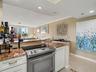 Kitchen opens to Living and Balcony