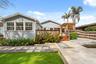 Rear exterior with landscaping and stepping stone path