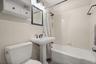Bathroom with tub and shower combination