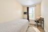2nd. Floor: Neutral-toned walls, wood-finish flooring, a single-hung window with casing, and a classic metal radiator