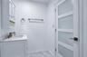 Fully renovated primary bathroom with new door