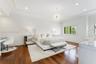Recessed lighting, crown molding, wood-finish flooring, white window shutters, and a crystal chandelier