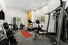 Dedicated fitness space featuring recessed lighting, crown molding, and two windows with plantation shutters