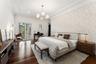 Hardwood flooring, crown molding, double-paned glass sliding doors, recessed lighting, and a modern light fixture