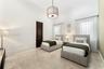 Recessed lighting and a drum pendant fixture illuminate the space