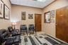 Drop ceiling featuring inset lighting, solid wood doors, and an interior pass-through window with wood casing