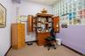 Interior room featuring a grid glass block window wall and neutral carpeting