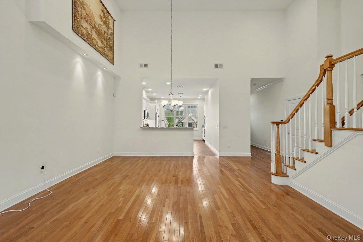 Dining area off kitchen with cathedral ceilings.