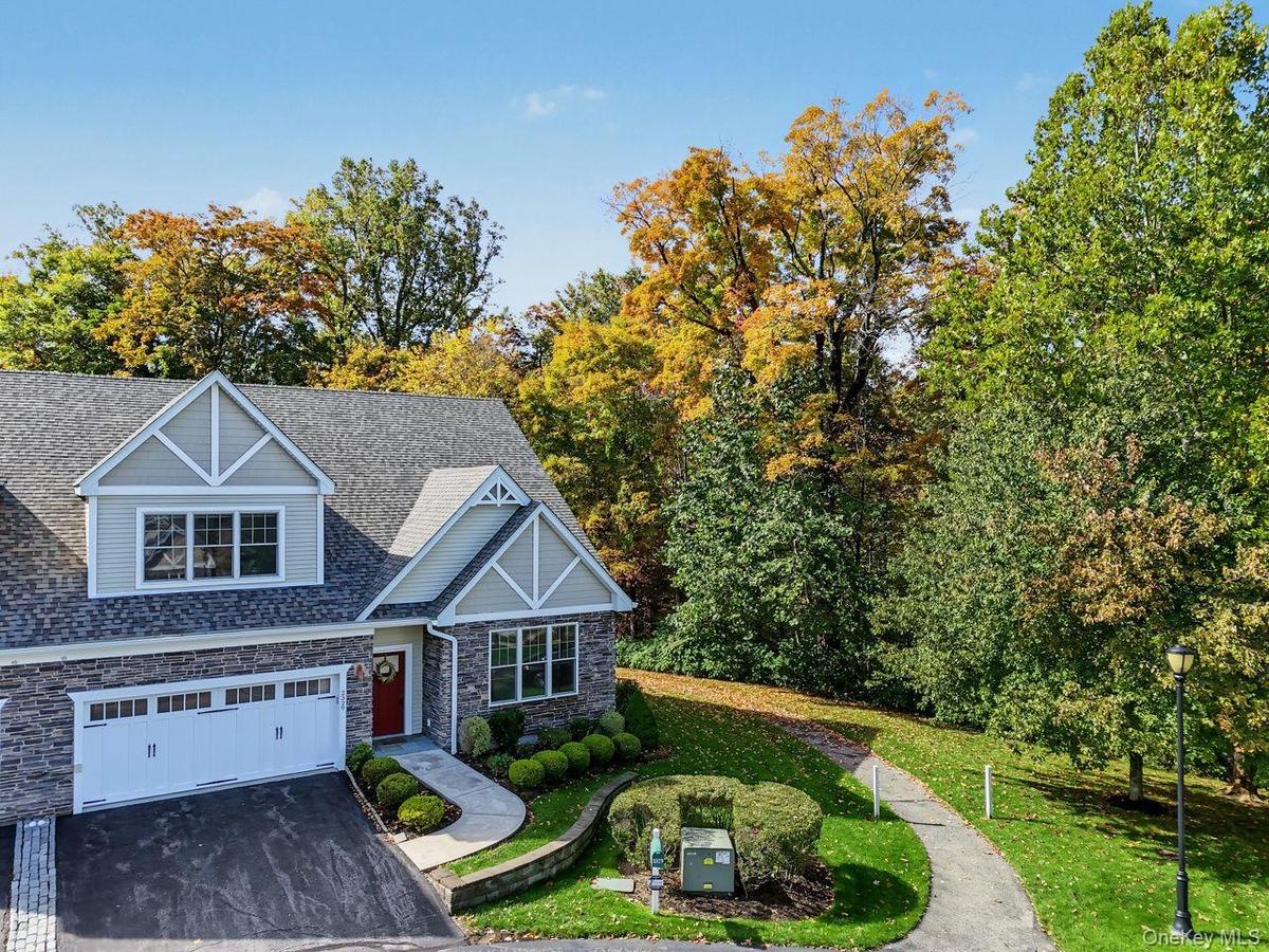 Enjoy the immaculate landscaping of the Hudson Valley in this private end unit.