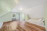 2nd Floor bedroom featuring laminate flooring, built in bed nook and doggie dormer