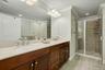 Primary bathroom with double sinks, walk in shower and soaking tub.