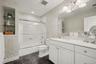 Second floor full bathroom with tub/shower combo.
