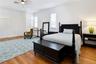 Expansive upstairs primary bedroom with plenty of space for a seating or work area.
