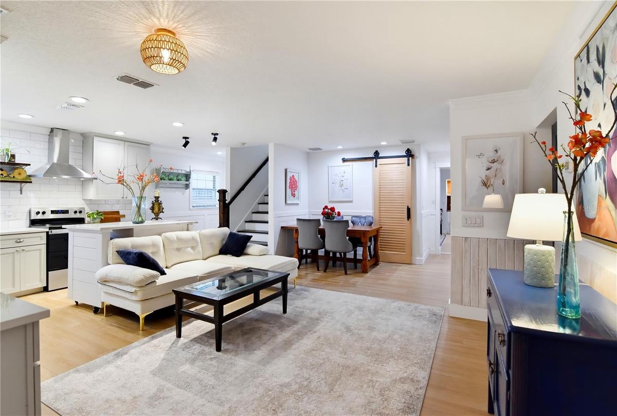 Bright, open-concept living and dining spaces with a beautifully redesigned kitchen.