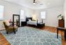 Private primary retreat featuring generous proportions and attractive wood-look flooring.