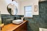 Beautifully appointed bathroom with distinctive tilework and updated fixtures.