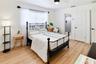 Another view of the downstairs bedroom, featuring ample space for furnishings.