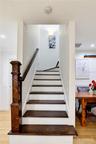 Interior staircase leading to the private second-floor primary suite.