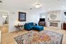 Beautiful stone wood-burning fireplace serves as a focal point of the family room.