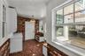 Spacious Mudroom provides entry to carport while a granite countertop, cabinets and a large closet offer both convenience and functionality
