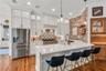 The chef's kitchen is a true focal point with a distinctive mix of old-world charm and modern design that combine luxury and function