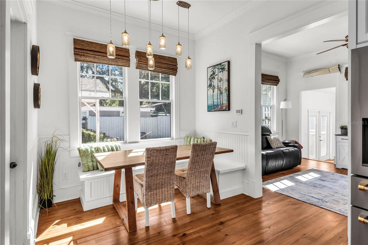Bright and cozy breakfast nook with built-in seating