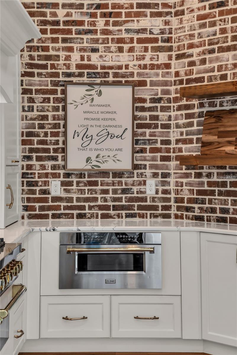 The chef's kitchen is a true focal point with a distinctive mix of old-world charm and modern design that combine luxury and function