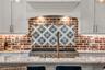 The chef's kitchen is a true focal point with a distinctive mix of old-world charm and modern design that combine luxury and function
