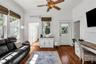 Home Office with custom built in desk and access to laundry room.