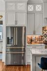 The chef's kitchen is a true focal point with a distinctive mix of old-world charm and modern design that combine luxury and function