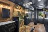 Oversized spa inspired bathroom features with dual vanities, two private water closets, a large glass-enclosed shower and elevated finishes throughout