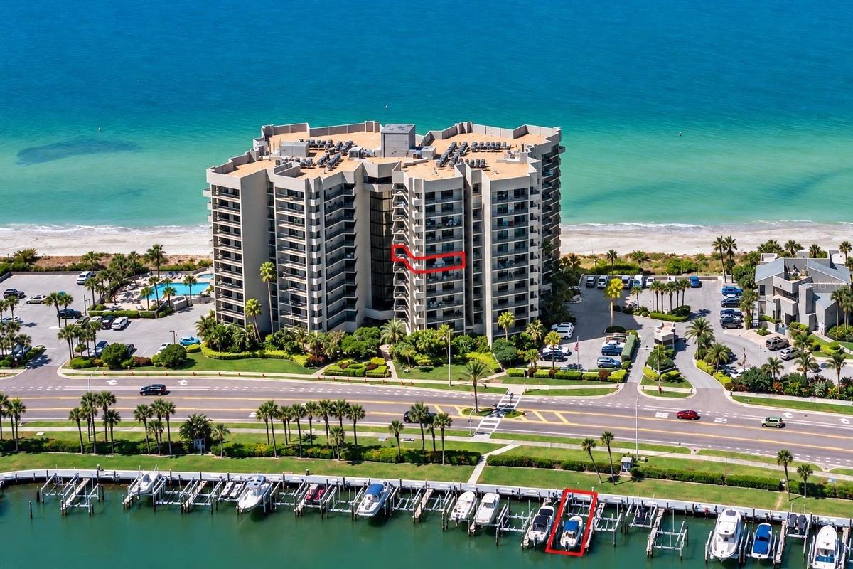 Beachfront living meets boater's paradise. Toes in the sand and your 45' deeded yacht slip with 2 lifts.