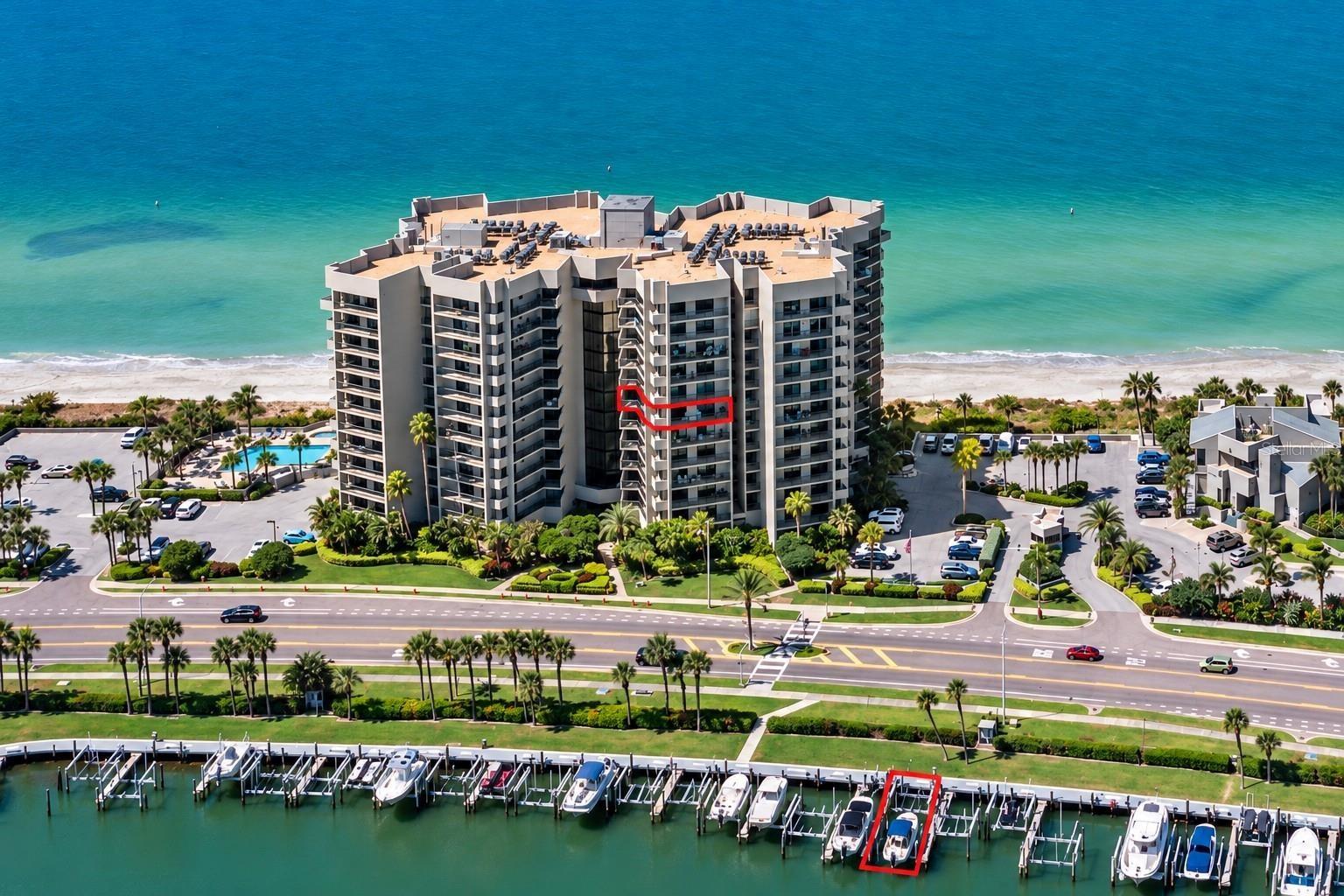 Beachfront living meets boater's paradise. Toes in the sand and your 45' deeded yacht slip with 2 lifts.