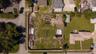 Aerial of vacant lot zoned B4 with frontage on Voorhis to the South and Dexter to the East