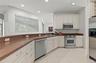 Open Kitchen to the Living Room and Family Room, stainless steel appliances.