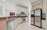 Open Kitchen to the Living Room and Family Room, stainless steel appliances.