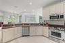 Open Kitchen to the Living Room and Family Room, stainless steel appliances.