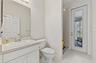 Guest Bathroom with door to the rear patio