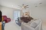 Oversized Family Room, with new ceiling fan and sliding doors to the back yard.