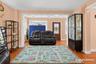 Hardwood-finish flooring, recessed lighting, and a front entry door with leaded glass accents