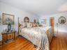 Hardwood floors, walk in closet and primary bathroom