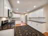 Tiled backsplash and stainless steel appliances
