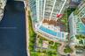 High-rise property featuring an expansive outdoor recreation deck with a multi-level swimming pool, manicured lawn areas, wood-finish decking, and dir