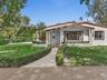 Single-story house set deep on a large lot in Coral Gables within walking distance to University of Miami and minuted from South Miami shops/ cafes. S