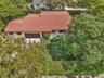 Single-story house for rent on a huge corner lot, featuring a tile roof, an attached two-car garage, and established landscaping.House for rent in Cor