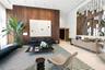 Floor-to-ceiling wood-paneled wall, custom geometric mirror installation, high ceilings with recessed lighting, and large-format tile flooring