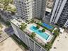 Rooftop amenity deck featuring a swimming pool, lap pool, tennis court, pergolas, and landscaped green space