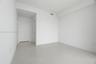 Neutral-toned large-format tile flooring, smooth wall finishes, and solid-core interior doors