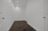 Interior space featuring wood-finish flooring, white walls, and recessed ceiling lighting